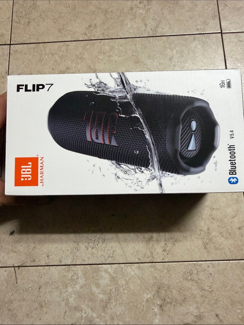 JBL Flip 7 Portable Bluetooth Speaker - Black with Orange Logo Accent